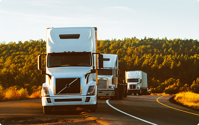 Warehouse worker wearing a safety vest and headset using a tablet in a distribution center